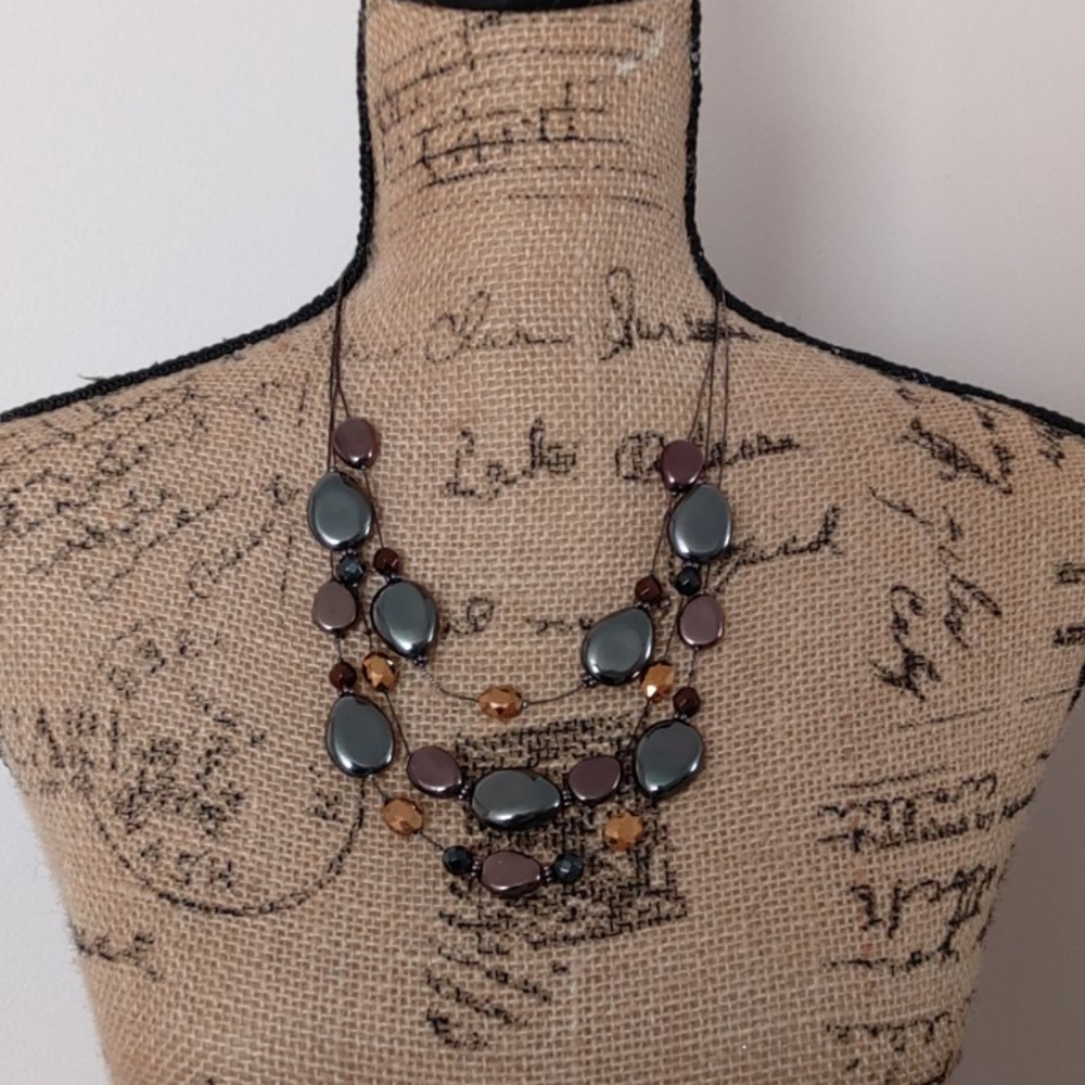 Multi strand metallic beaded statement necklace
